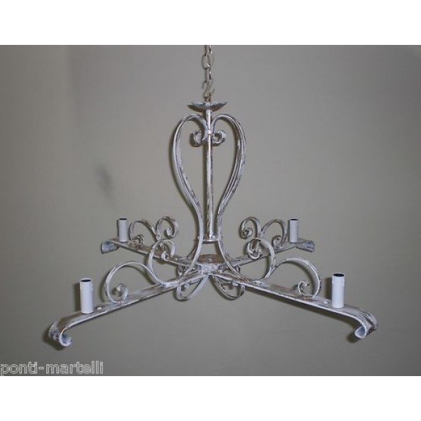 Wrought Iron Chandelier. Dimensions cm 75 x h 44 approx .  Ivory and Gold color . 4 Lights with candles . 277